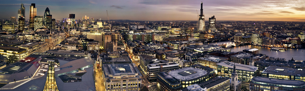rooftop view of the City of Florence, with flat red roofs and the Duomo