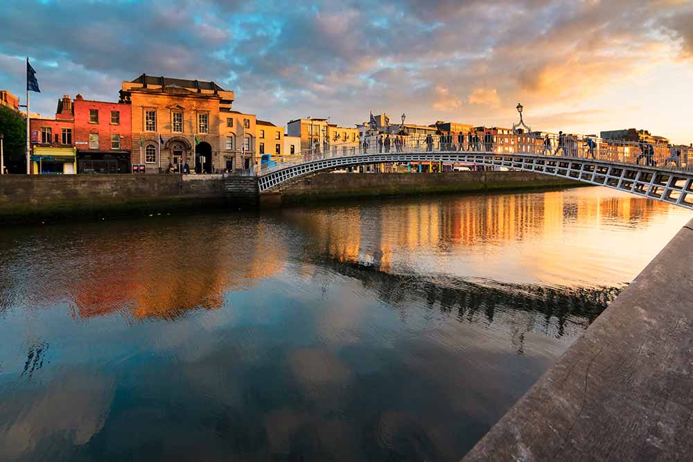 bridge over a river at sunset