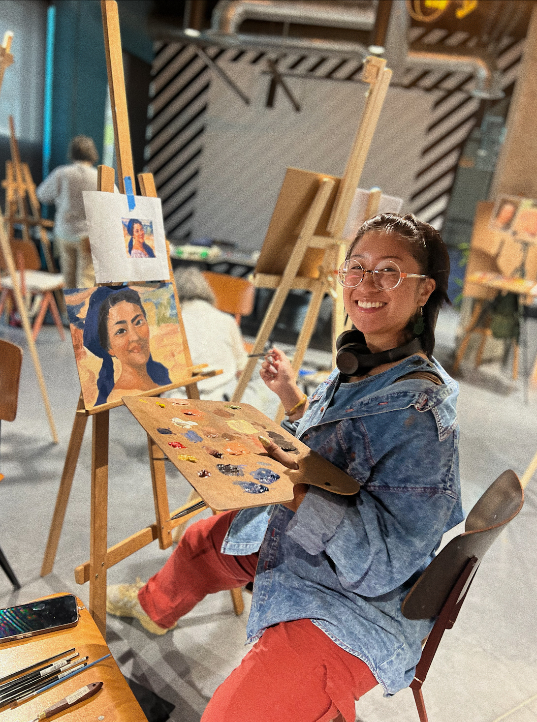 a smiling student in a Barcelona art studio