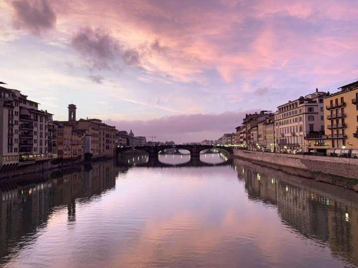 SMCCCD study abroad art contest winner, a photo of the sunset over a bridge and water in Florence