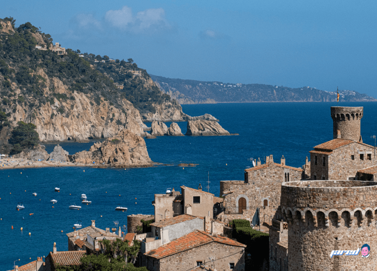 SMCCCD study abroad art contest winner, a photo of a bay with blue water and rocky mountain