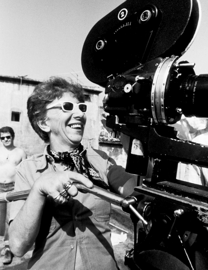 Film Director Lina Wertmuller with a film camera in black and white