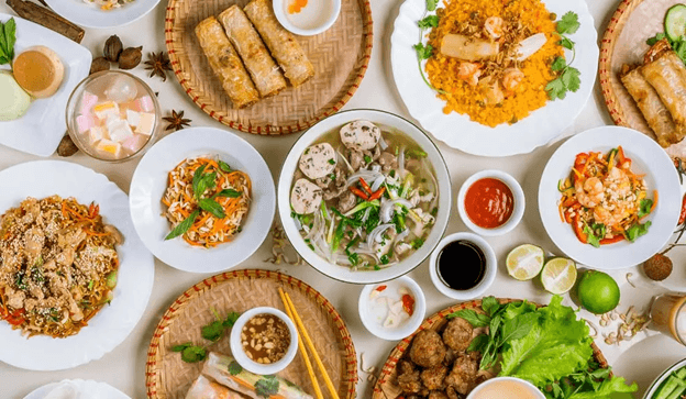 a bird's eye view of a spread of traditional Vietnamese foods